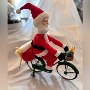 Mr Christmas Santa on a Bike uses 3 batteries moves and star in basket lights up